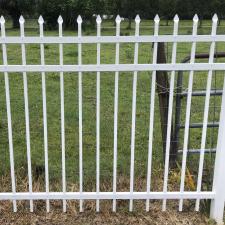 Transforming-a-White-Metal-Fence-from-Algea-Coated-to-Shiny-and-Crisp-Clean-A-Pressure-Washing-Soft-Washing-Success-in-New-Smyrna-Beach-Florida 1